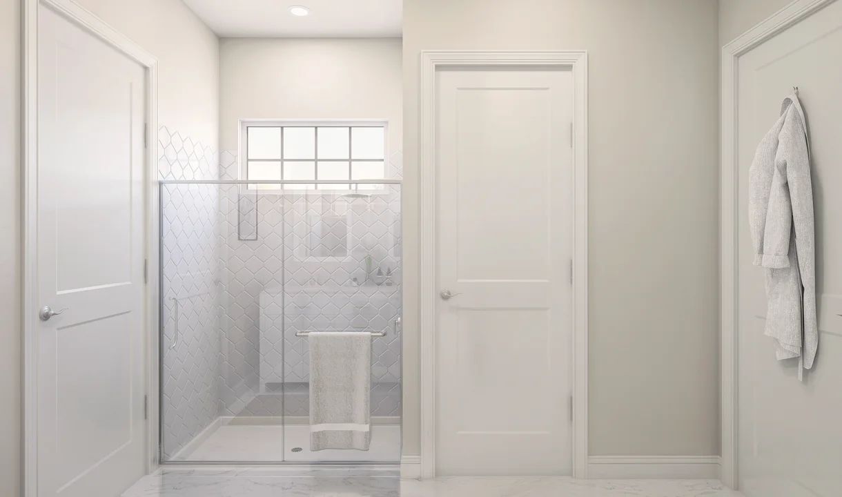 Primary bath with glass shower enclosure