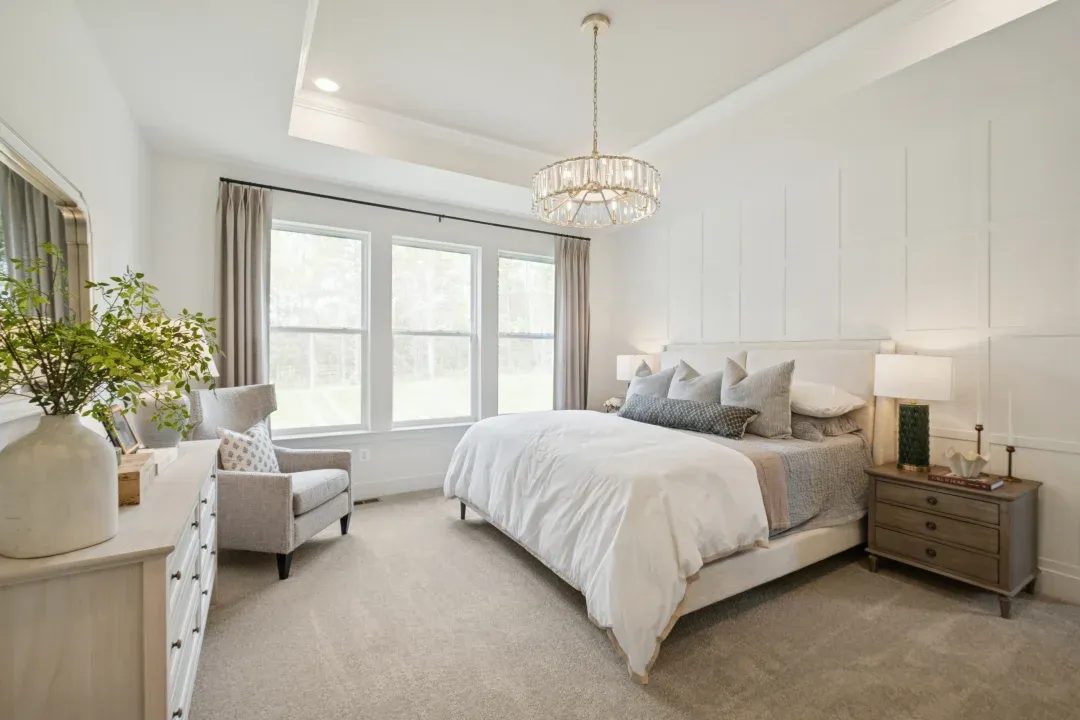 Primary suite with decorative feature wall
