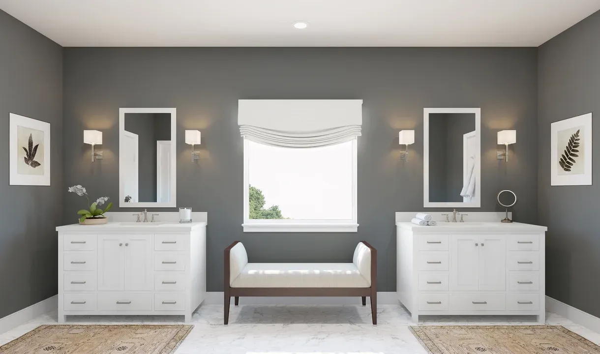 Primary bath features dual freestanding vanities