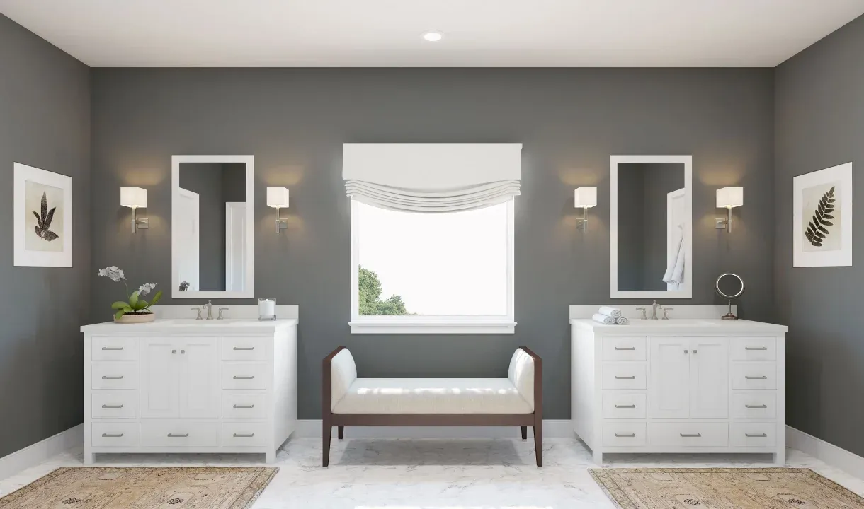 Primary bath features dual freestanding vanities