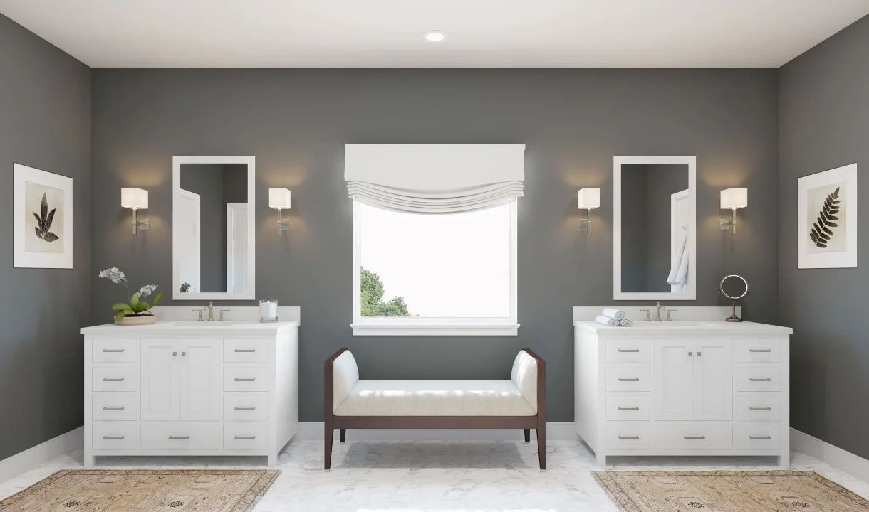 Primary bath features dual freestanding vanities