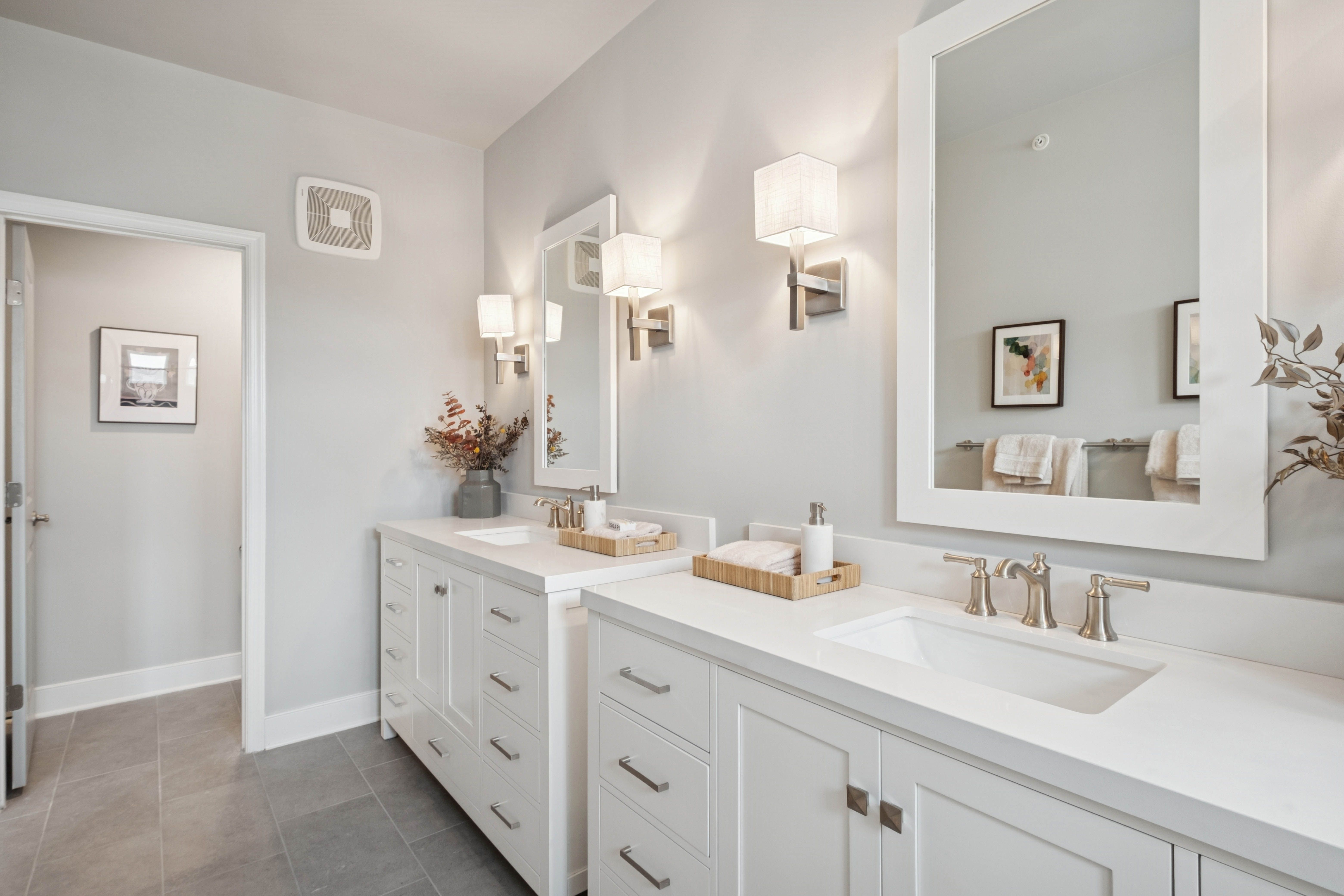 Brushed satin nickel hardware in primary bath