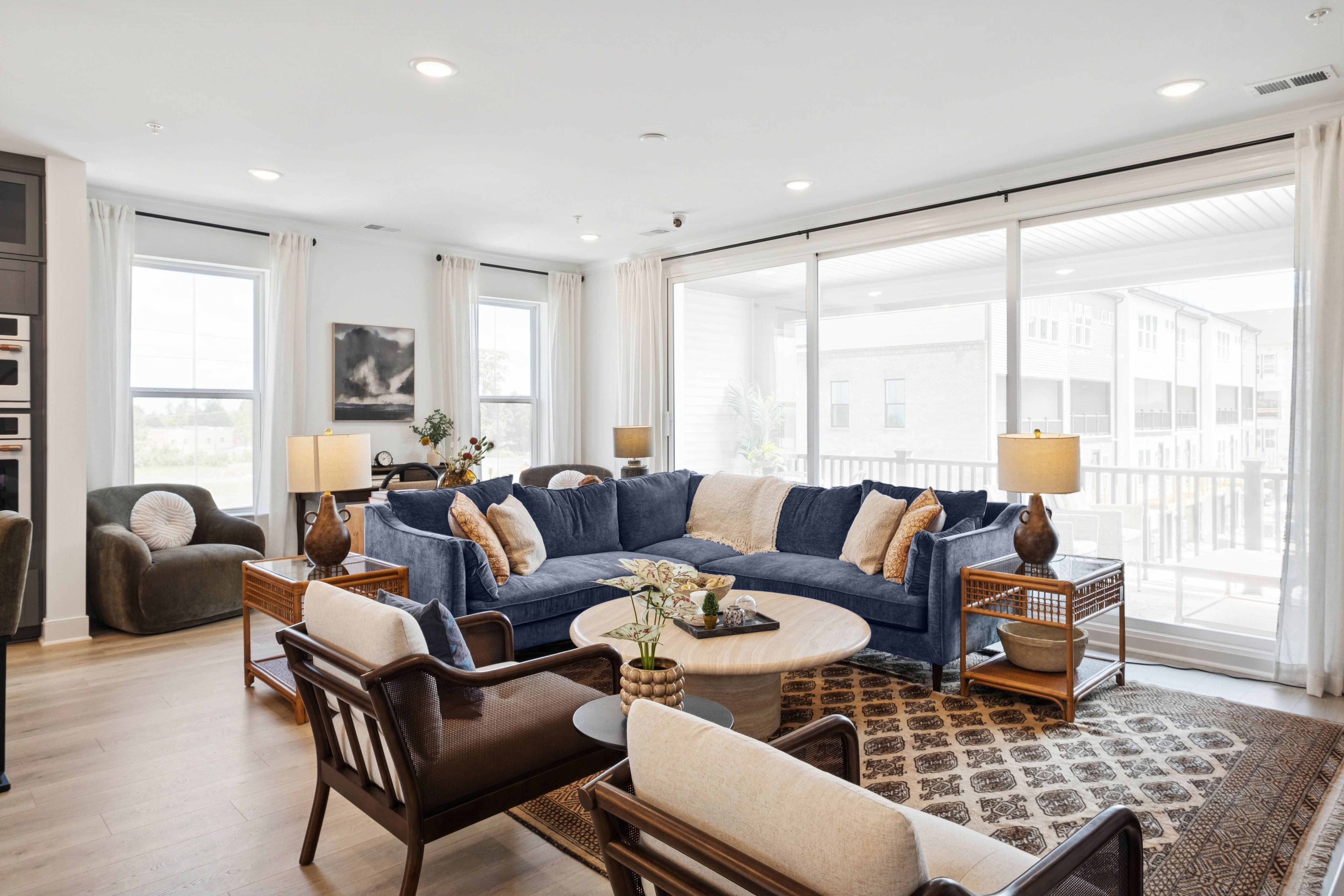 Great room with large multi-slide door to covered balcony