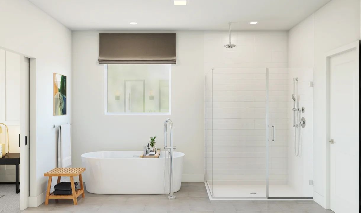 Primary bath with freestanding tub and glass shower enclosure