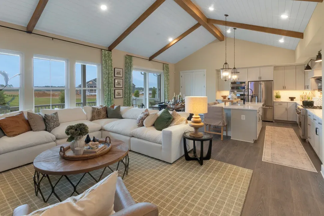 Great room with vaulted ceiling with stained ceiling beams