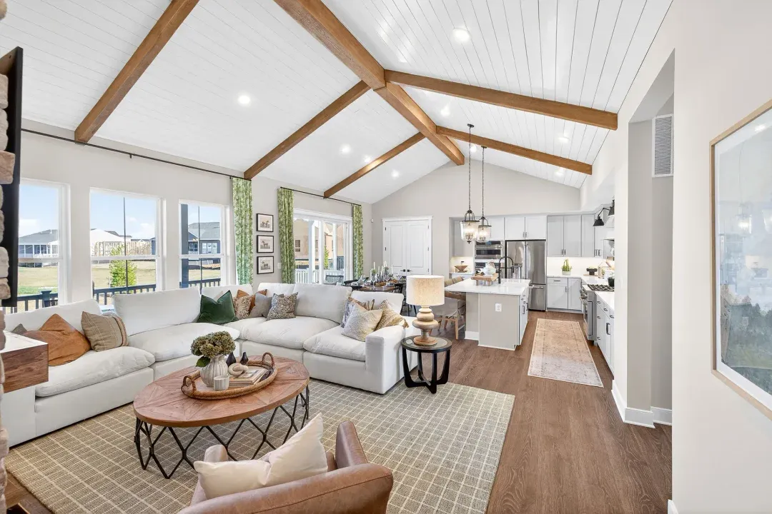 Great room with vaulted ceiling with stained ceiling beams