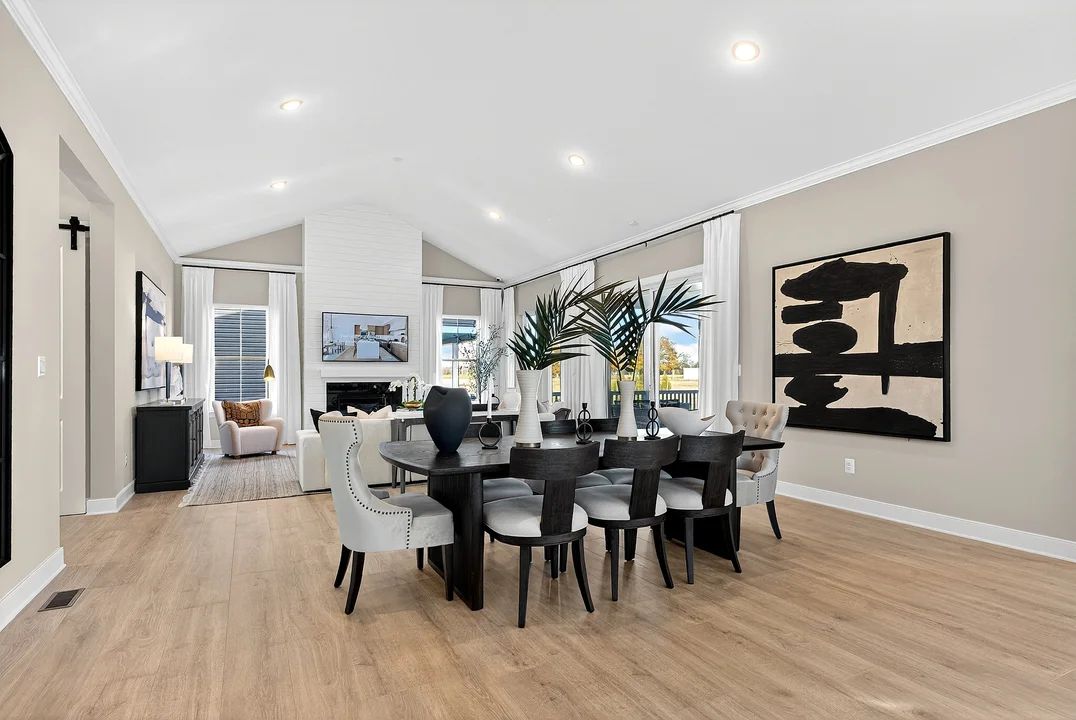 Great room and dining area with vaulted ceiling