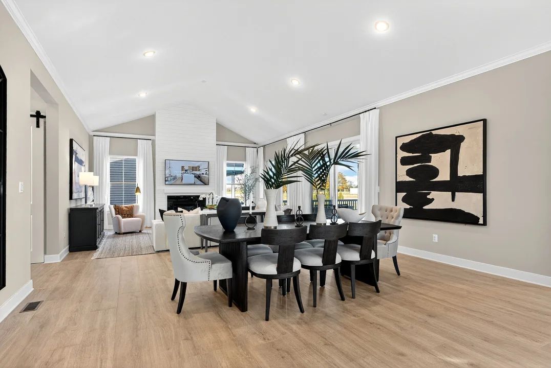 Great room and dining area with vaulted ceiling