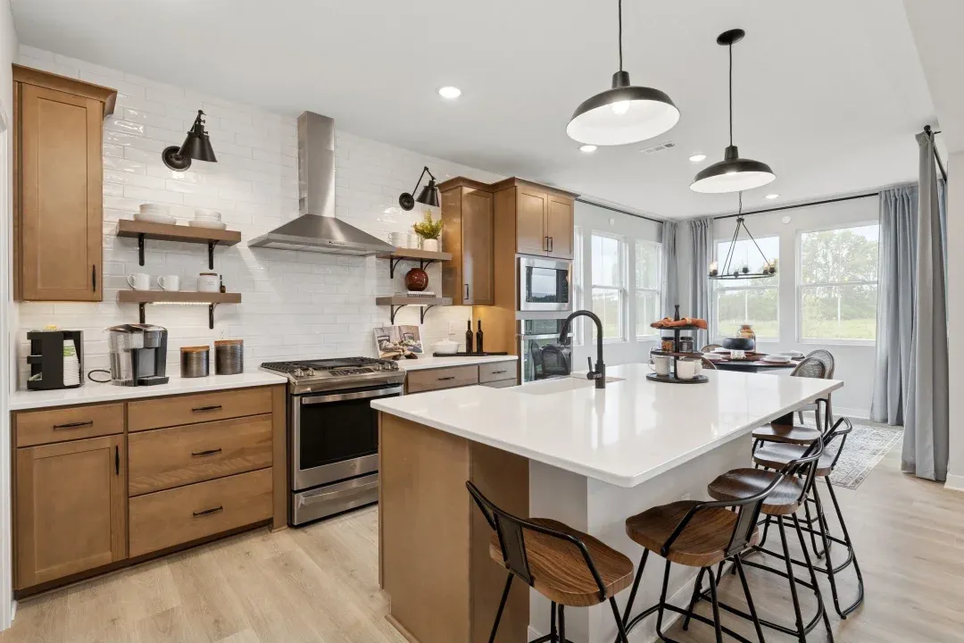 Kitchen with pendant lighting and subtle wood stained cabinets