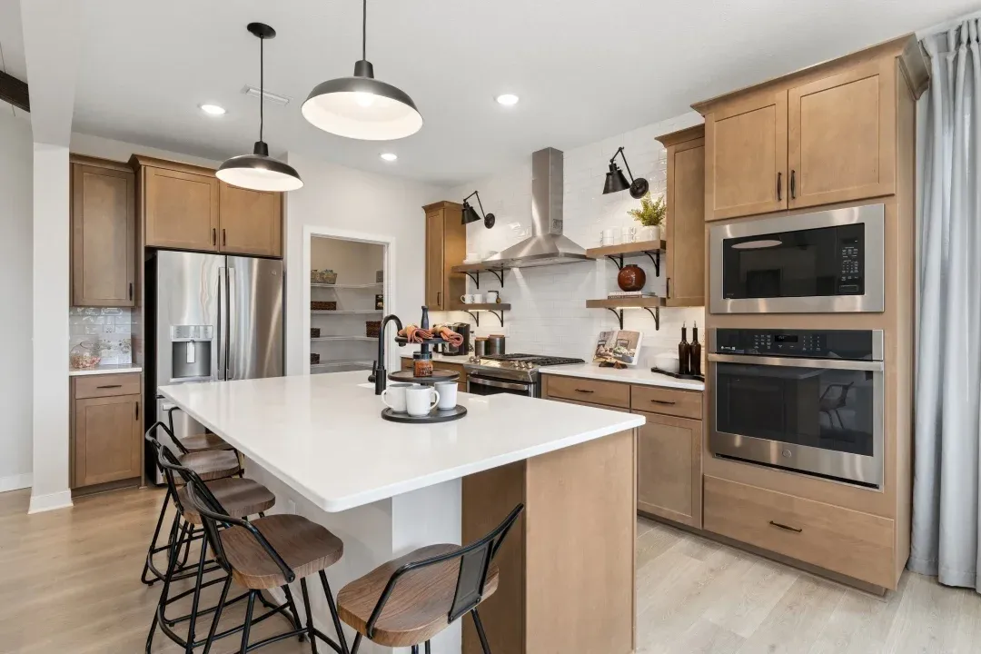 Kitchen with matte black hardware and floating shelves