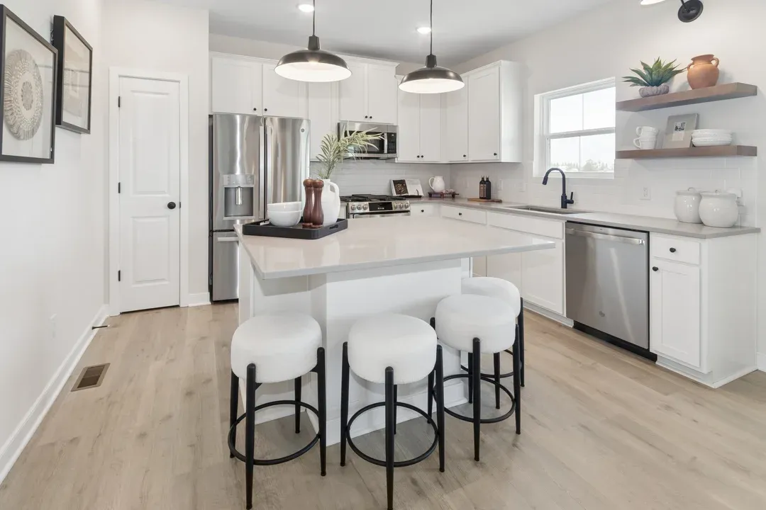 Kitchen with pendant lighting and floating shelves