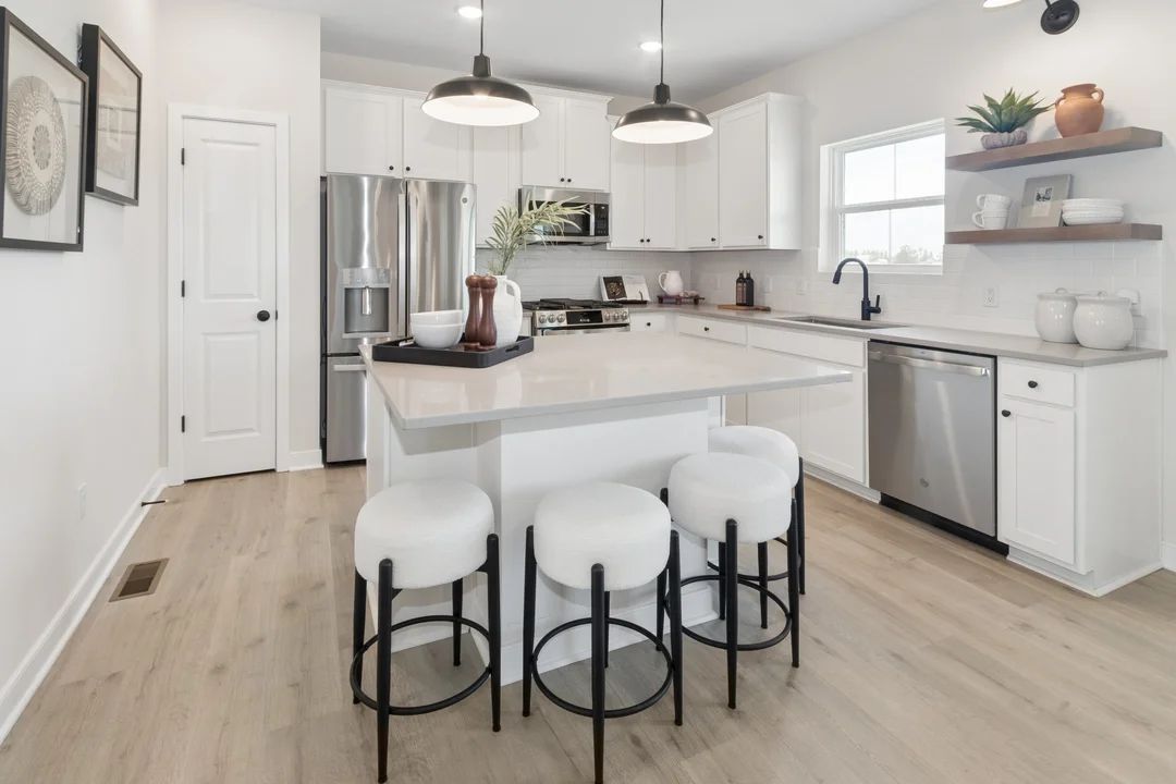 Kitchen with pendant lighting and floating shelves