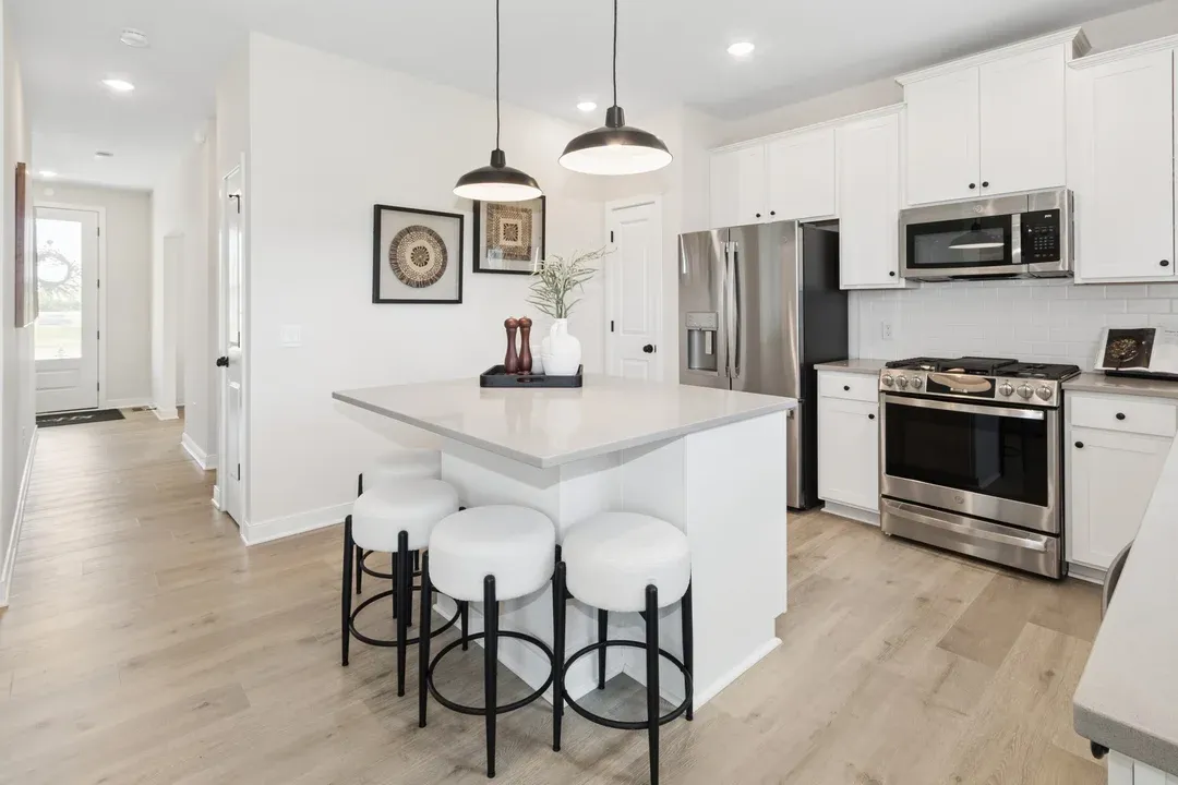 Kitchen with quartz countertops and matte black hardware