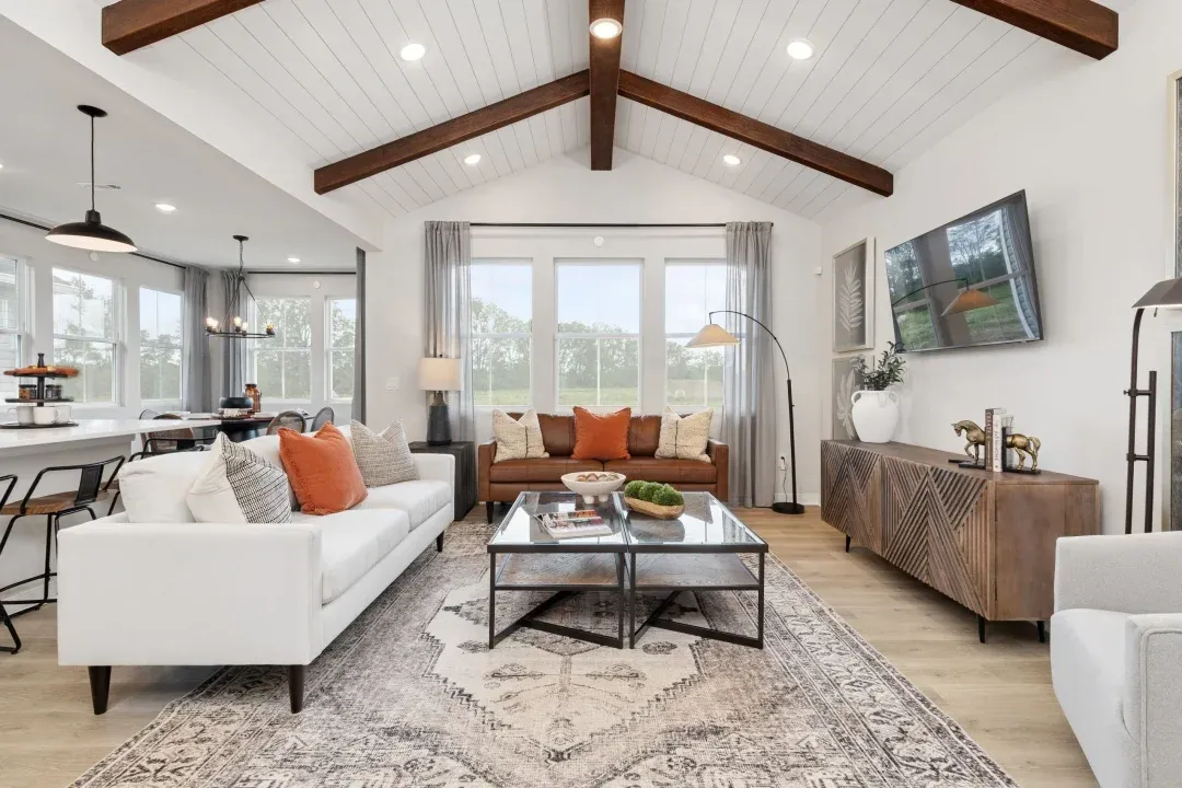 Great room with vaulted ceiling and stained ceiling beams