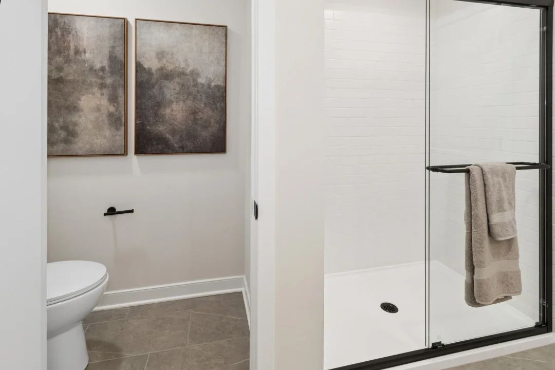 Primary bath with glass shower enclosure