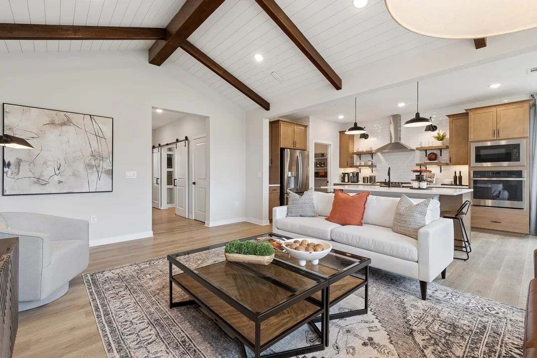 Great room with stained ceiling beams