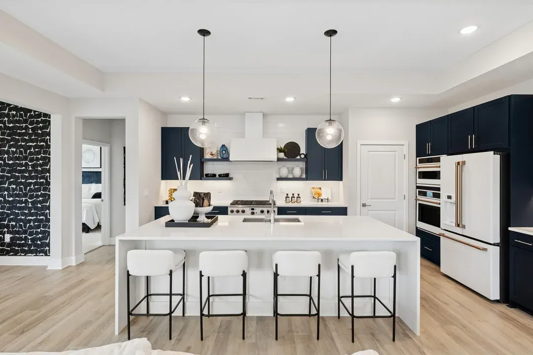 Kitchen with pendant lighting and floating shelves