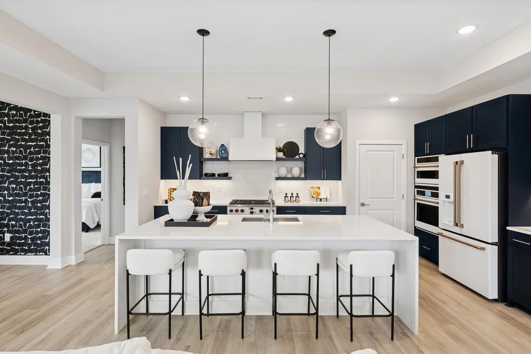Kitchen with pendant lighting and floating shelves