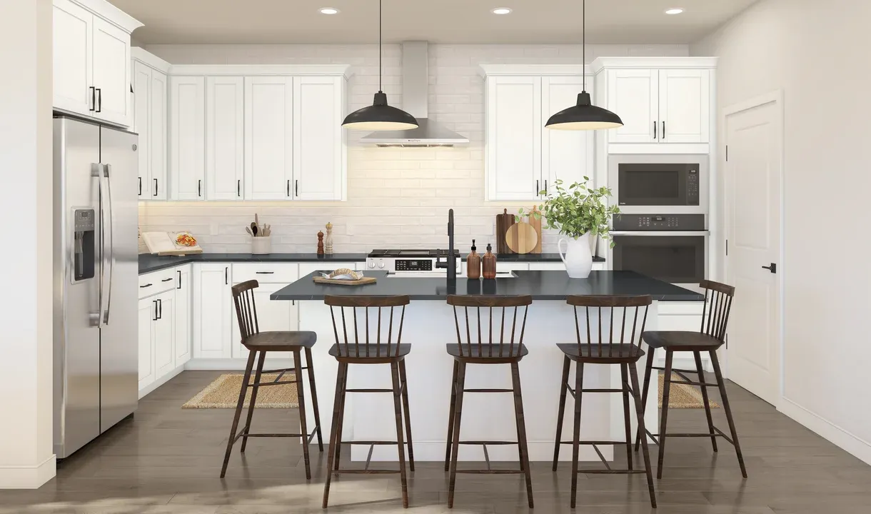 Kitchen with pendant lights and white cabinetry