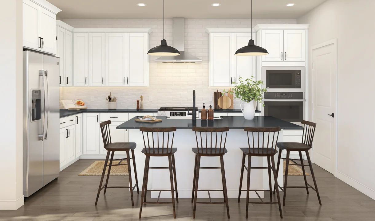 Kitchen with pendant lights and white cabinetry