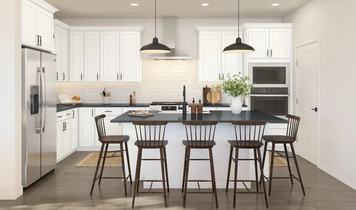 Kitchen with pendant lights and white cabinetry