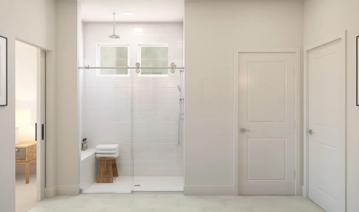 Primary bath with tile and glass door shower