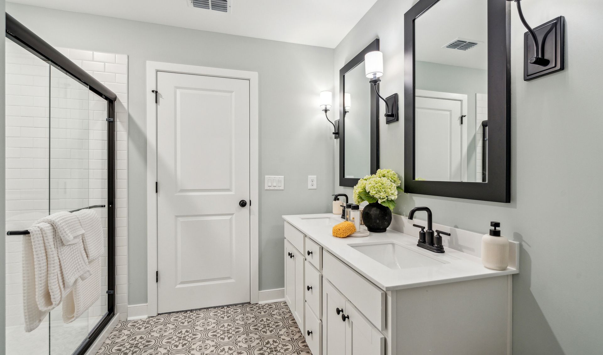 Primary bath with glass-shower enclosure