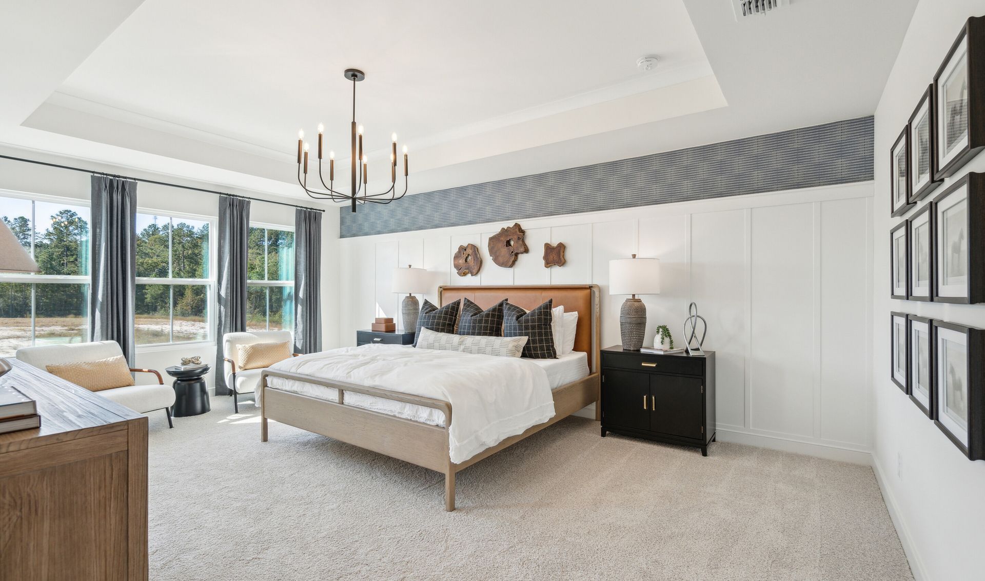 Primary suite with decorative feature wall
