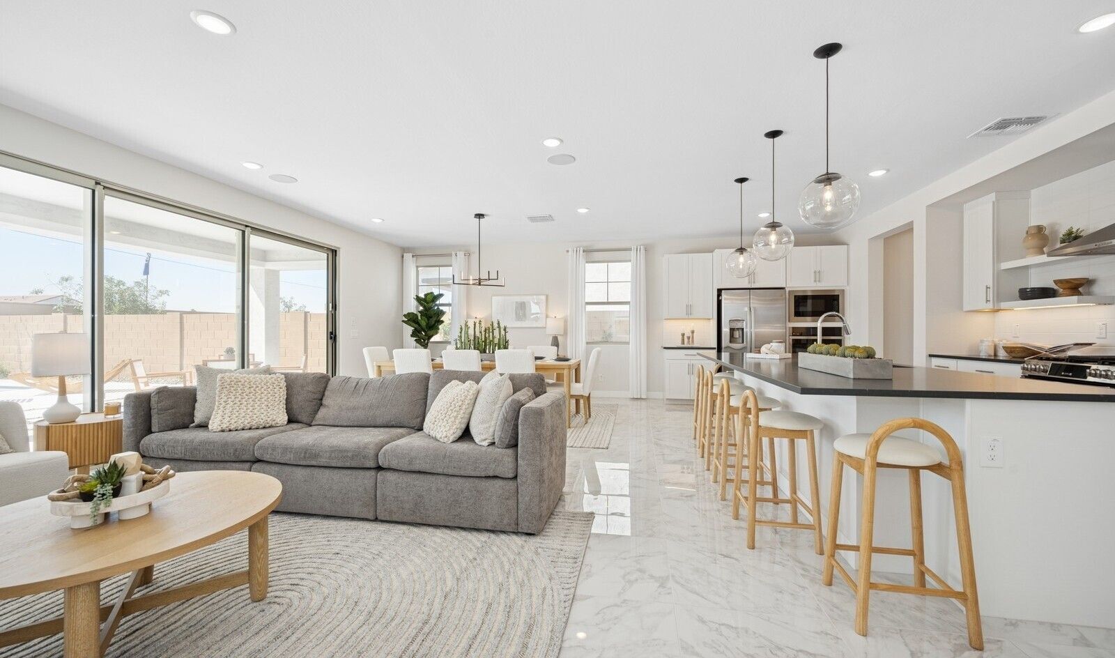 Great room with sliding glass door bringing in natural light