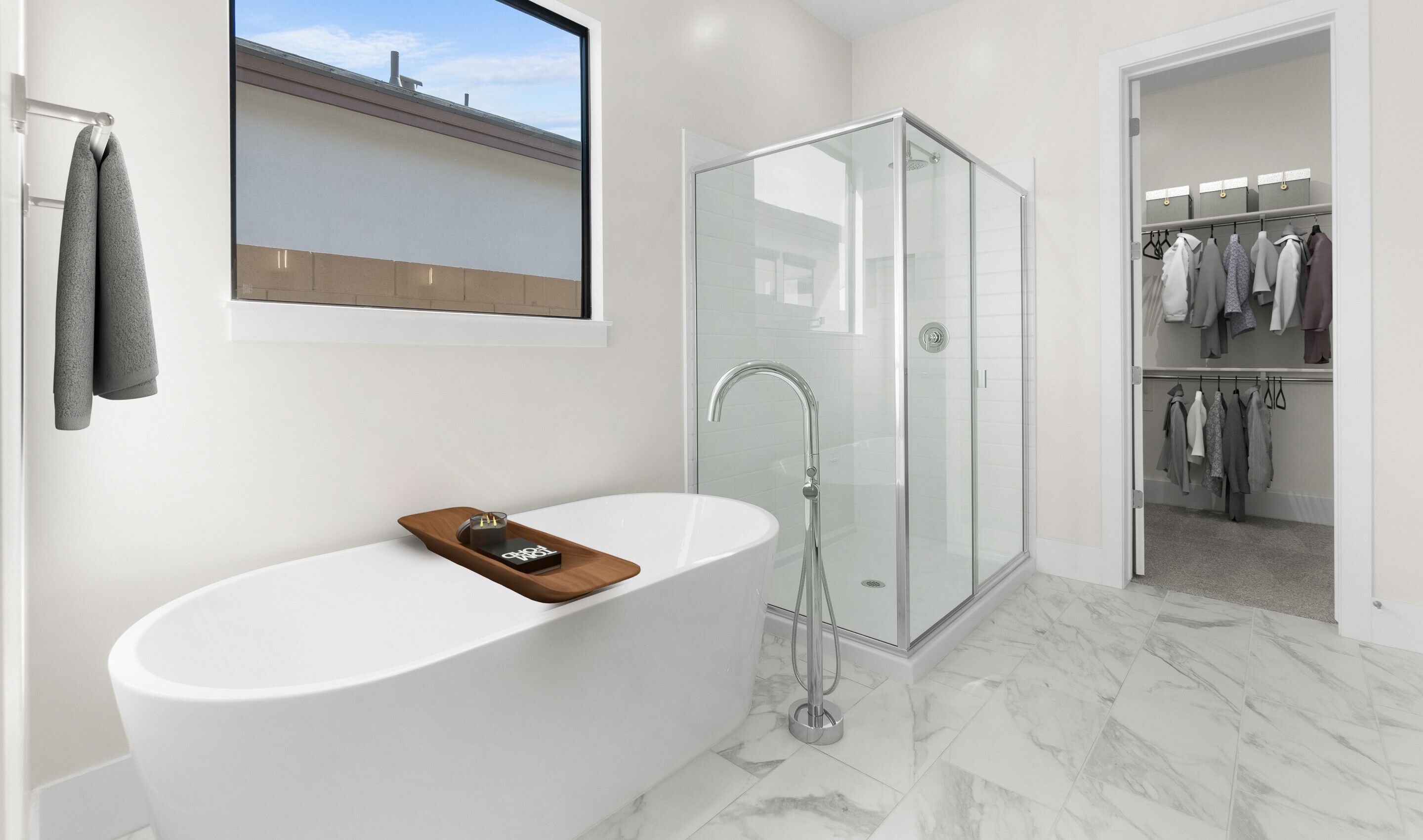 Primary bath with freestanding tub and glass shower enclosure