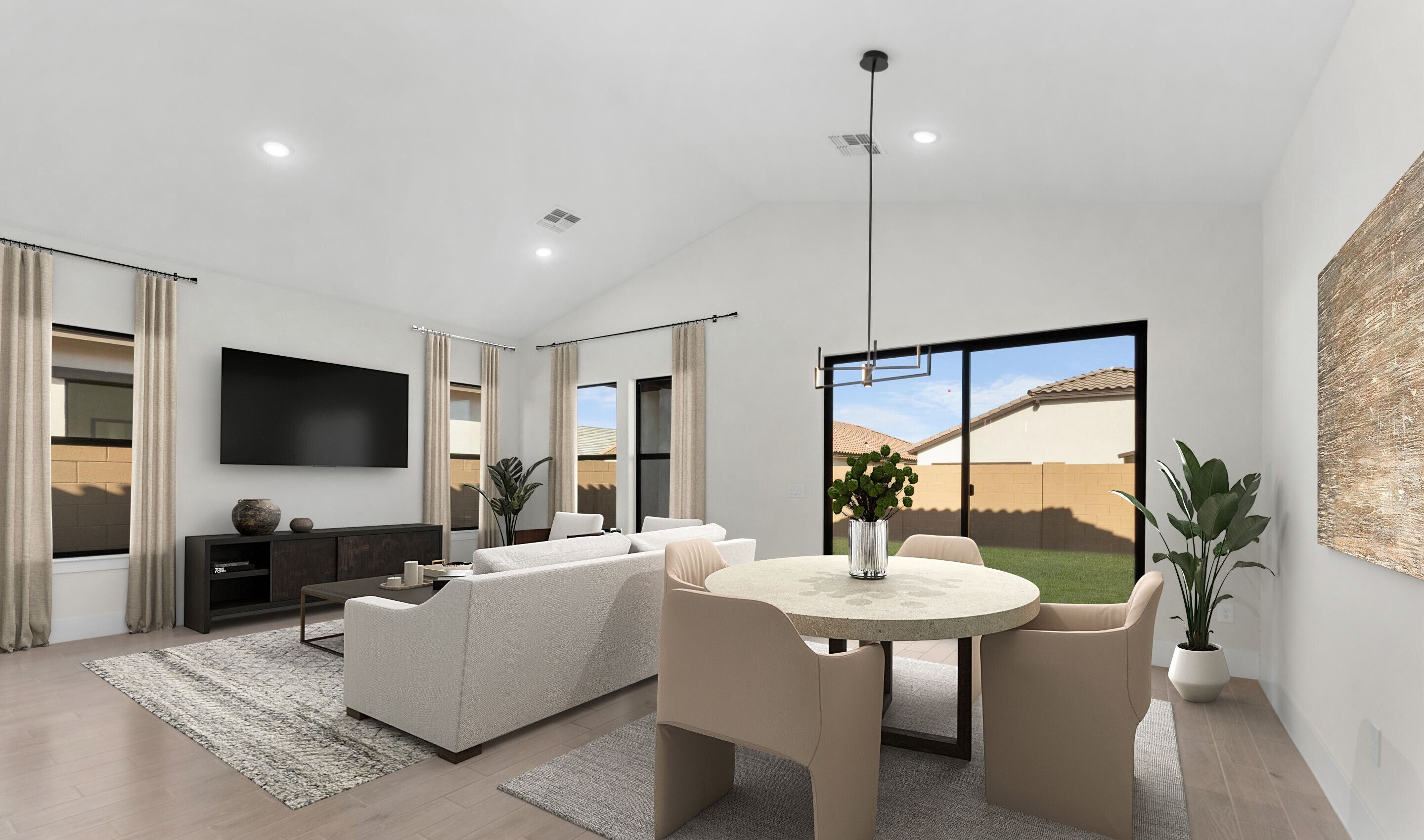 Dining area and great room with vaulted ceiling