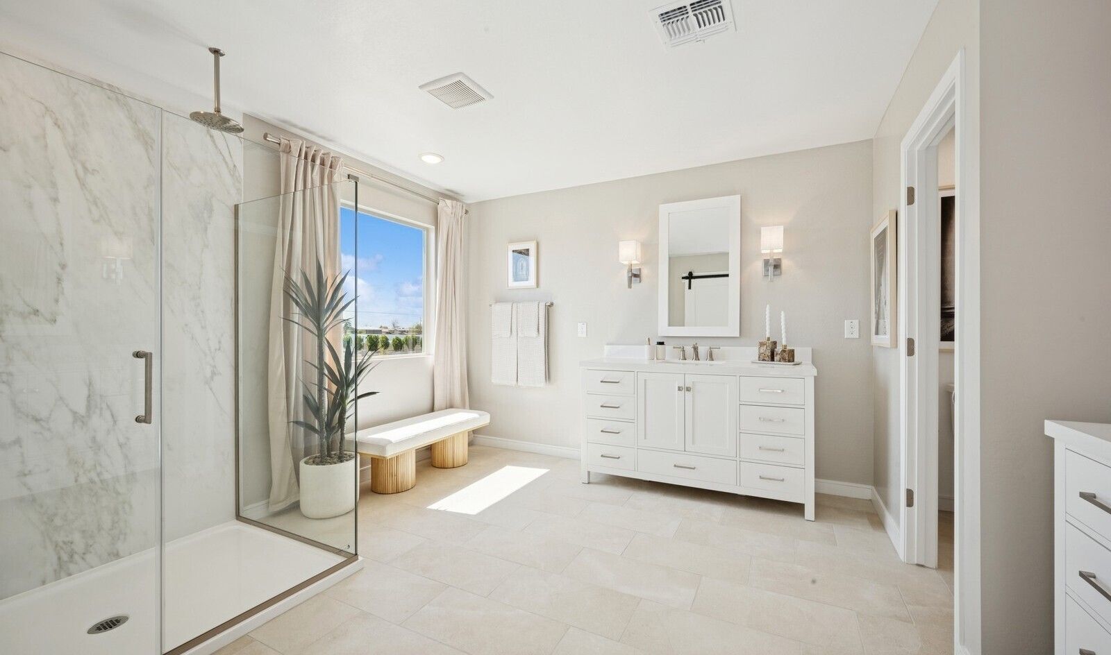 Primary bath with glass shower enclosure