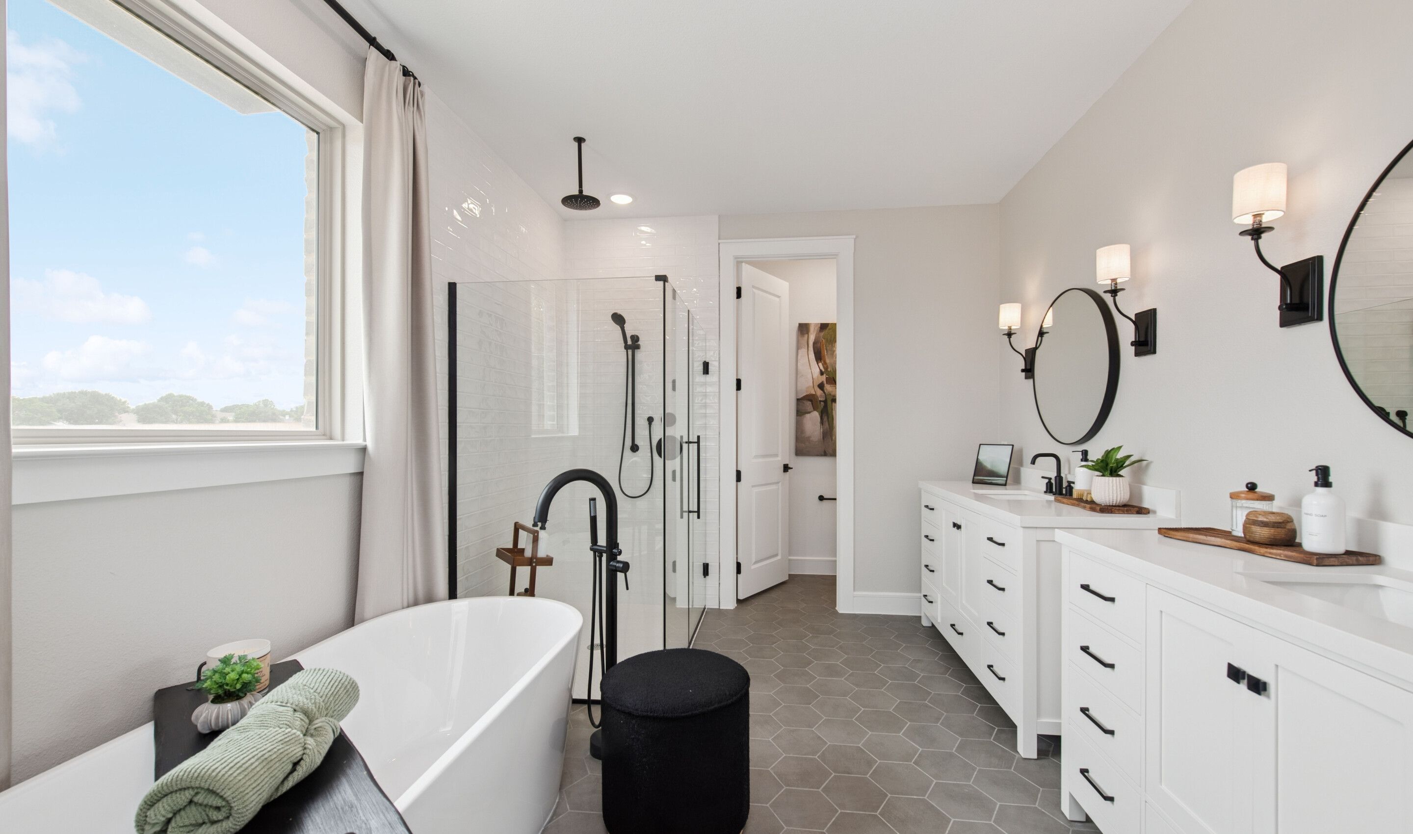 Primary bath with freestanding vanity and hexagonal tile