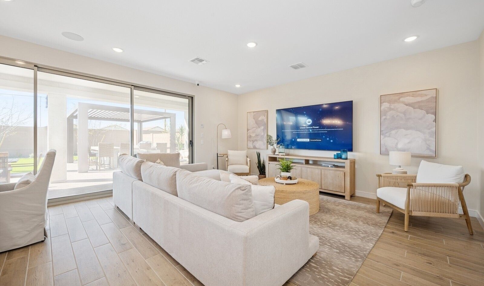 Great room with sliding glass doors and luxurious tile flooring