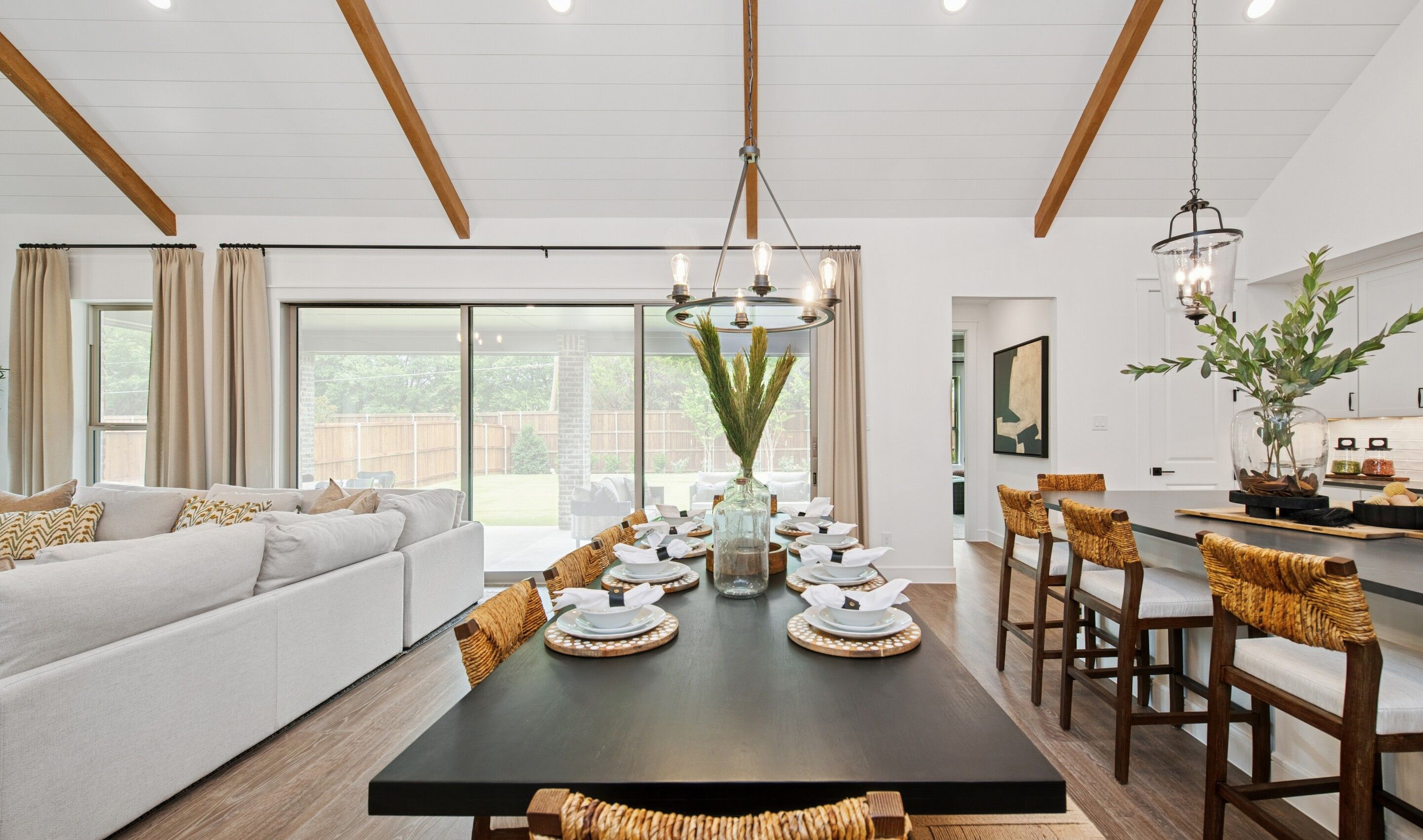 Vaulted ceiling in dining area with chandelier