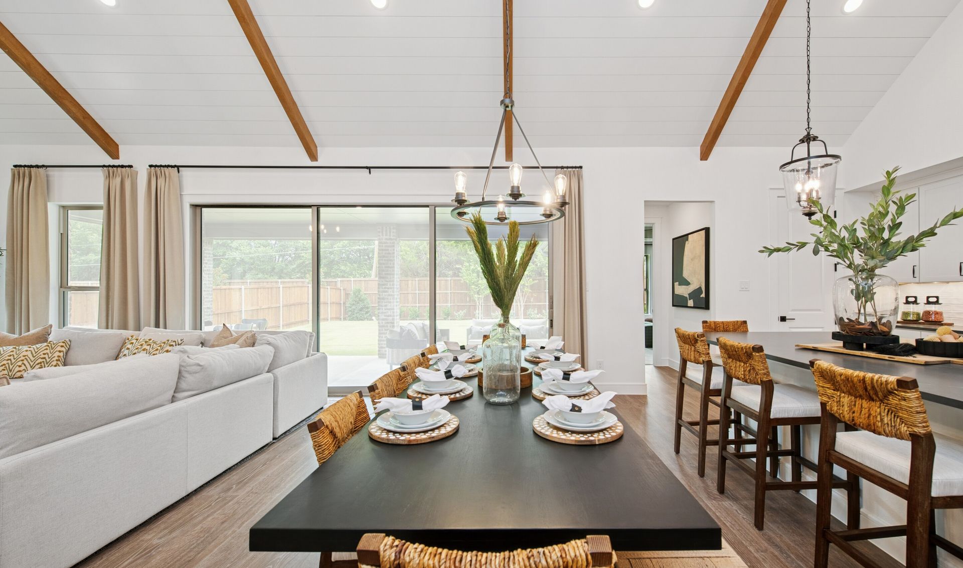 Vaulted ceiling in dining area with chandelier