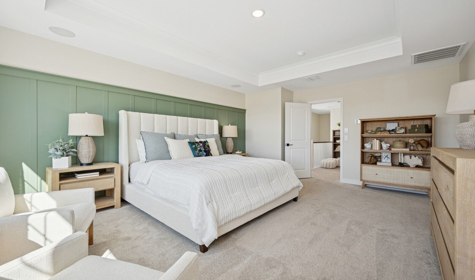 Primary suite with decorative feature wall