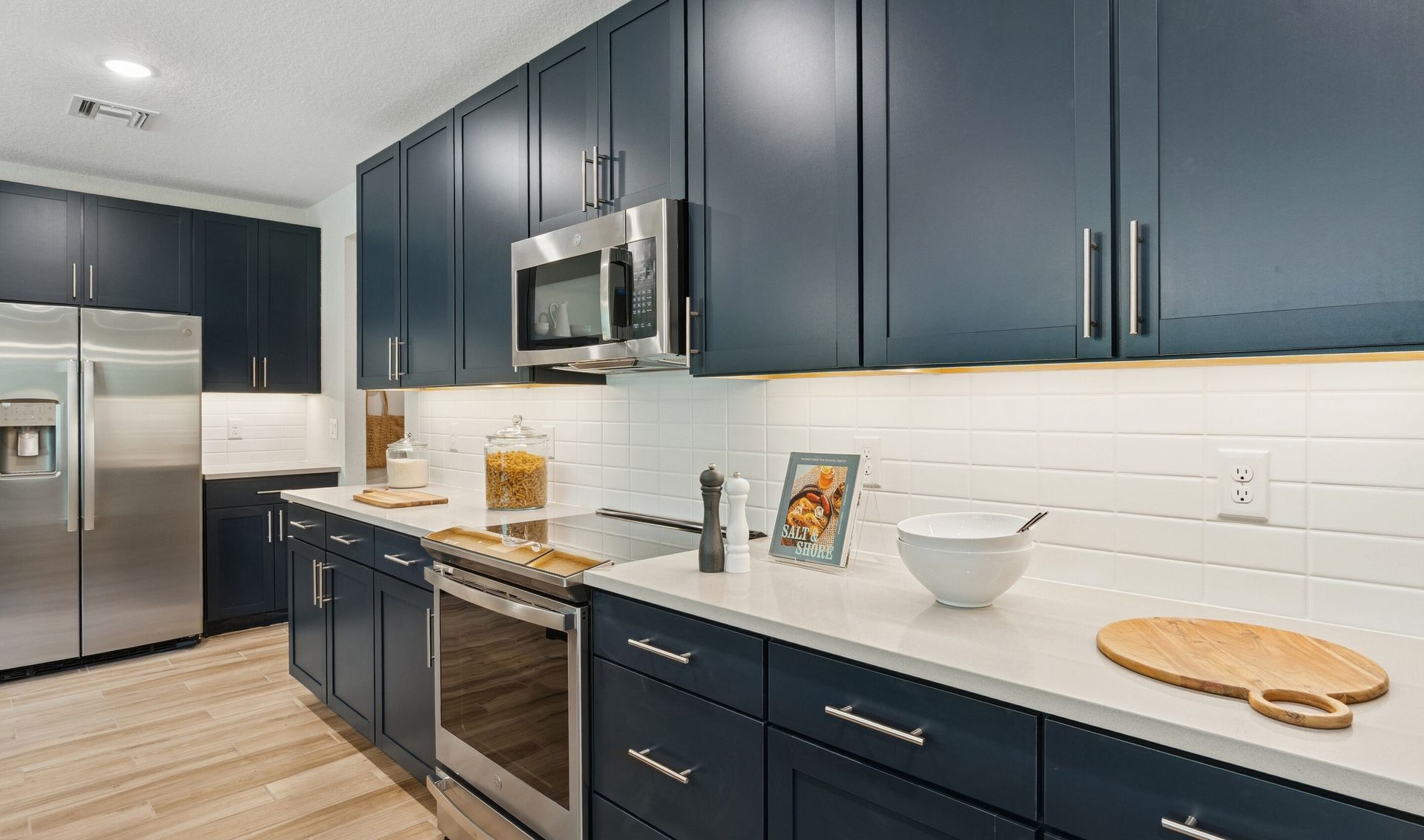 Kitchen with blue cabinets and quartz countertops