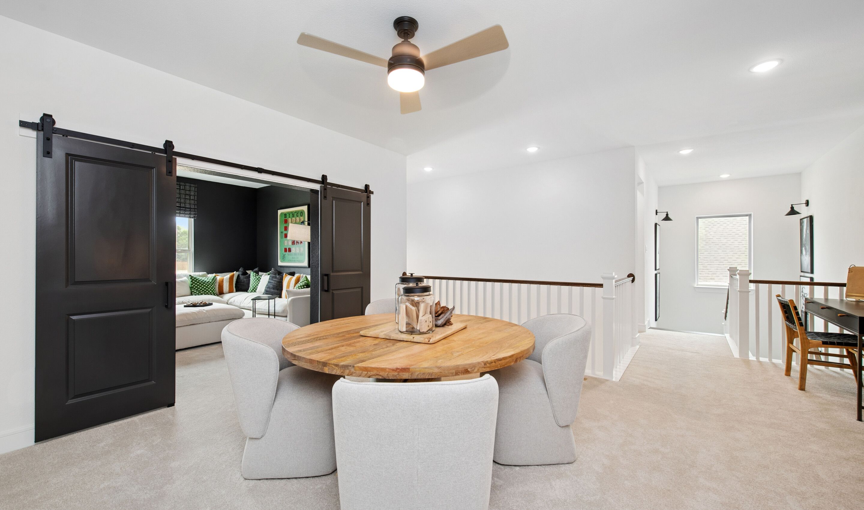 Versatile loft space with plush carpeting