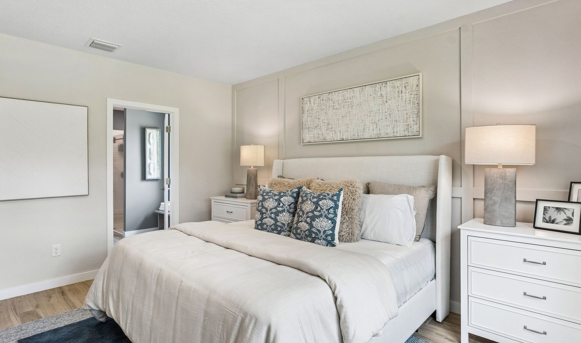Primary suite with decorative feature wall