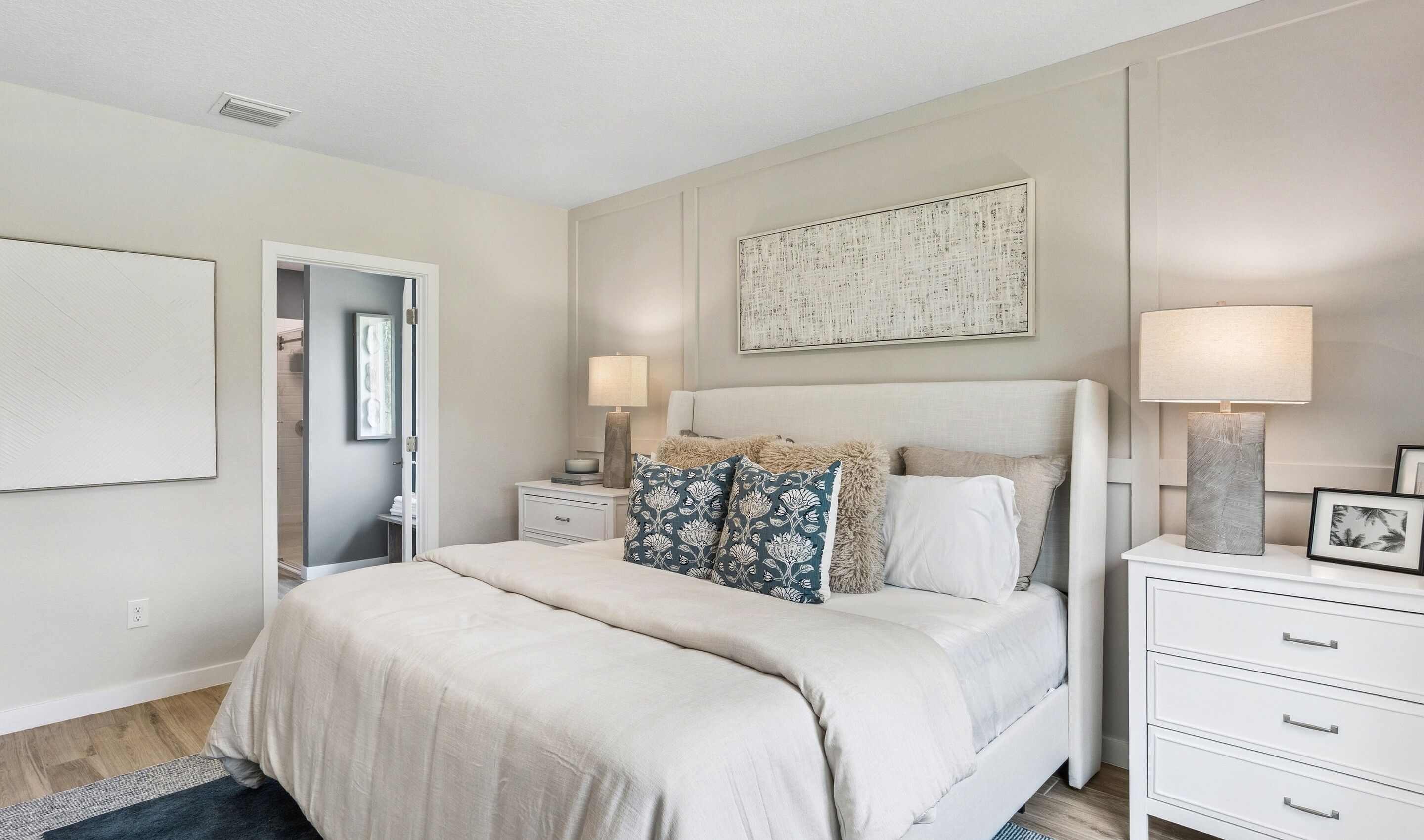 Primary suite with decorative feature wall