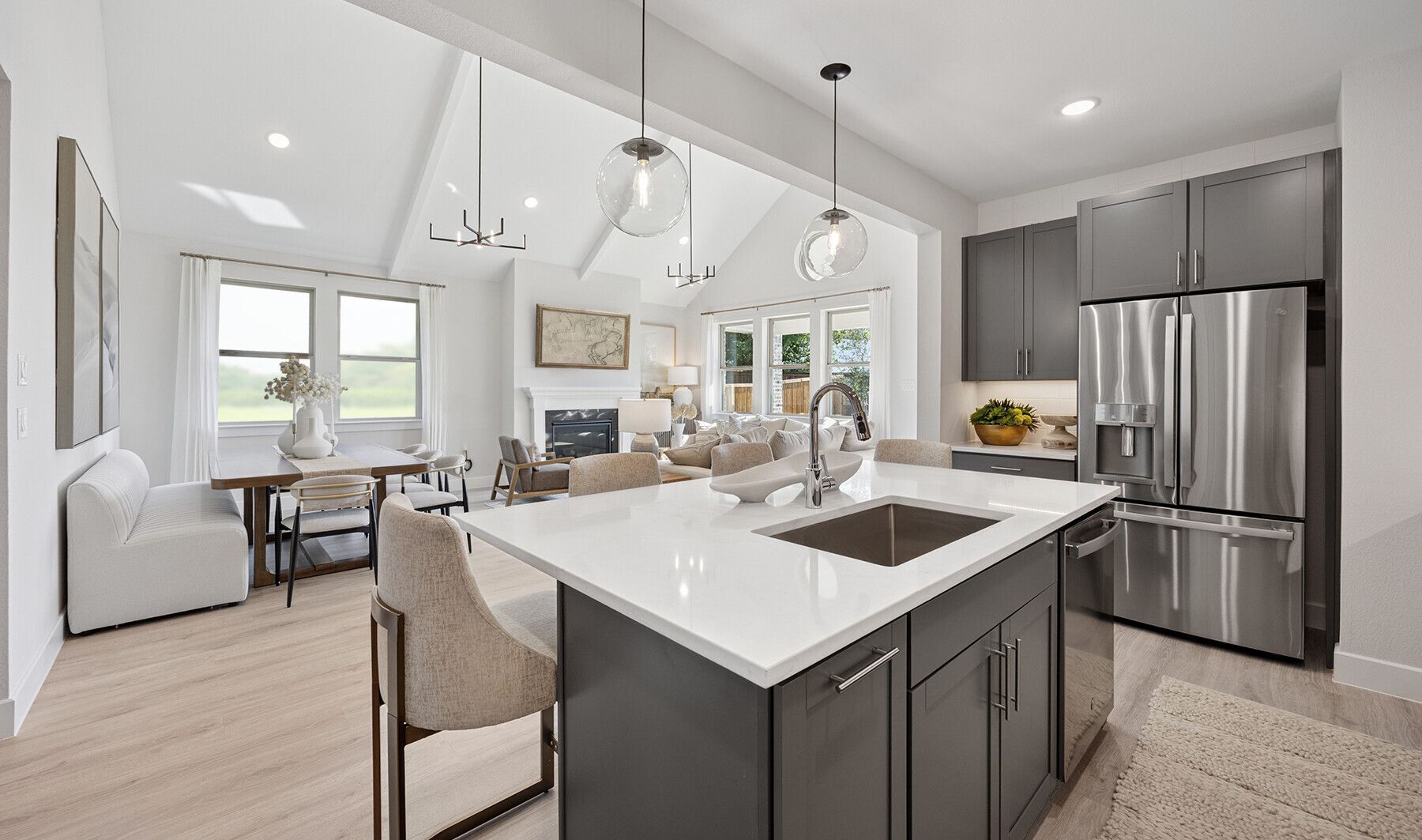 Kitchen overlooking open concept living spaces