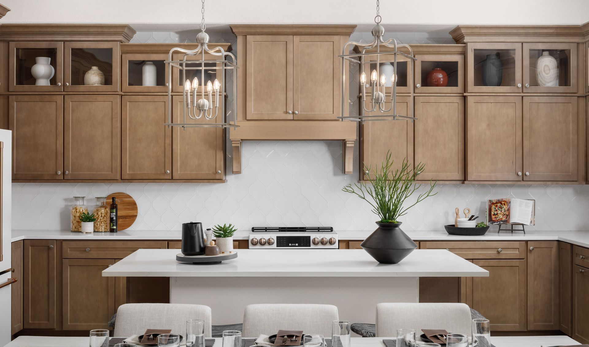 Kitchen with pendant lighting and stunning hood vent