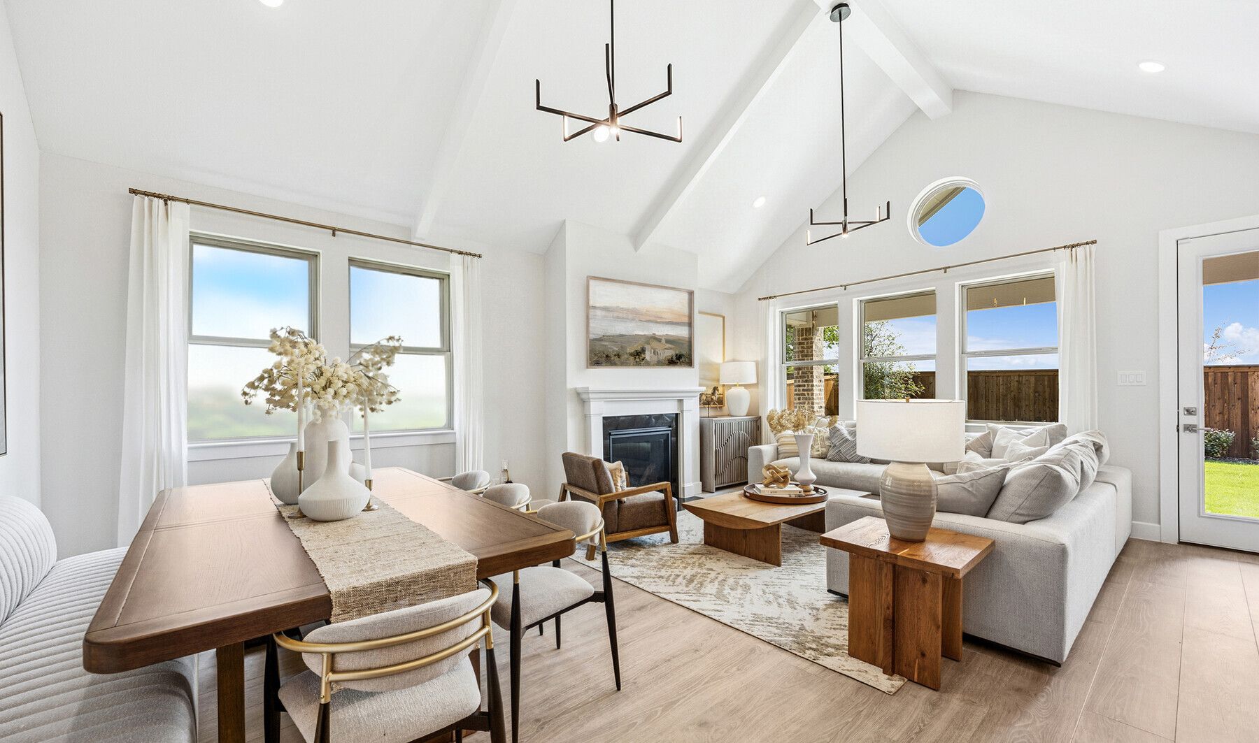 Open concept living spaces with vaulted ceiling
