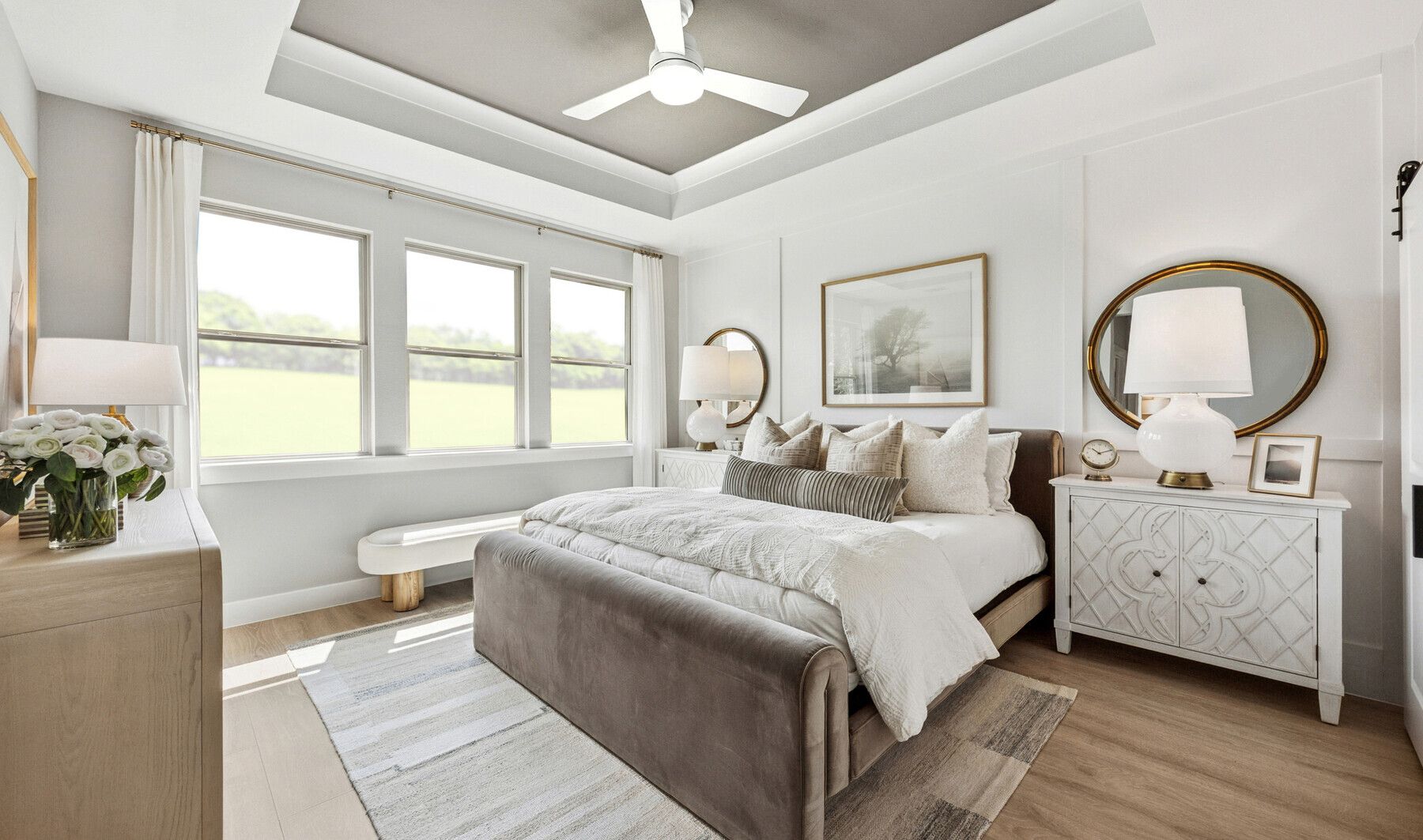 Primary suite with decorated feature wall & tray ceiling