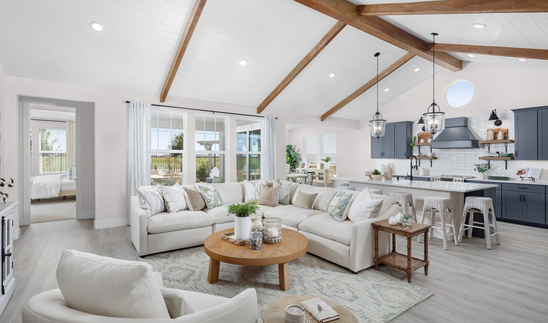 Great room with vaulted ceiling and stained ceiling beams
