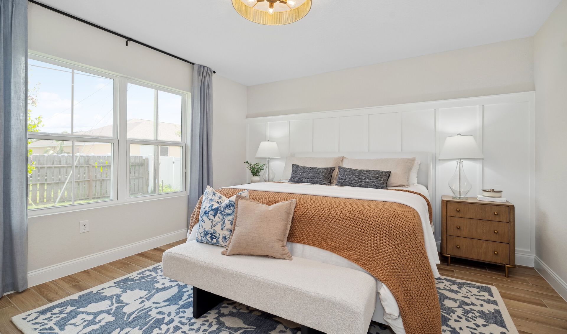 Primary suite with decorative feature wall