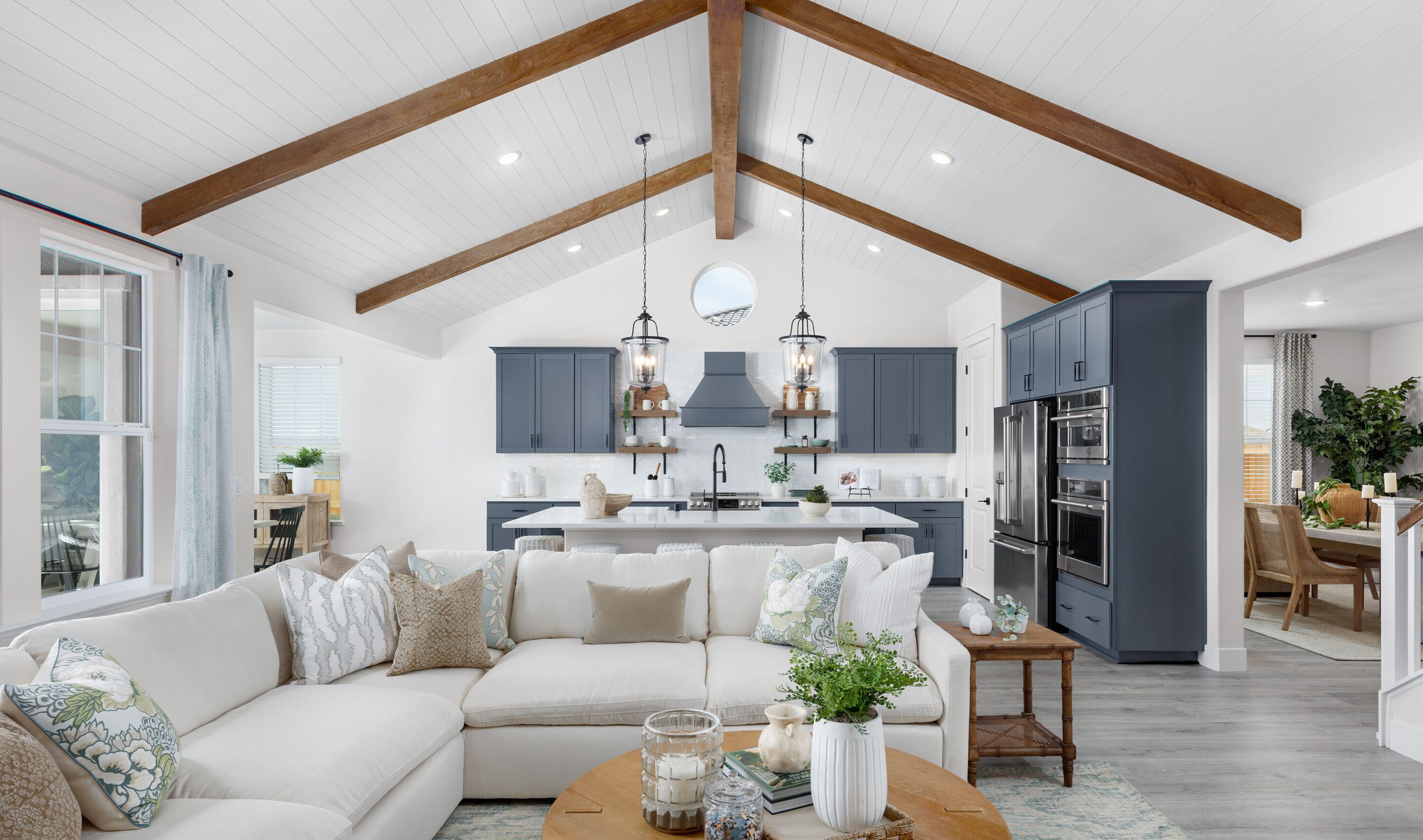 Vaulted ceiling and stained ceiling beams in great room