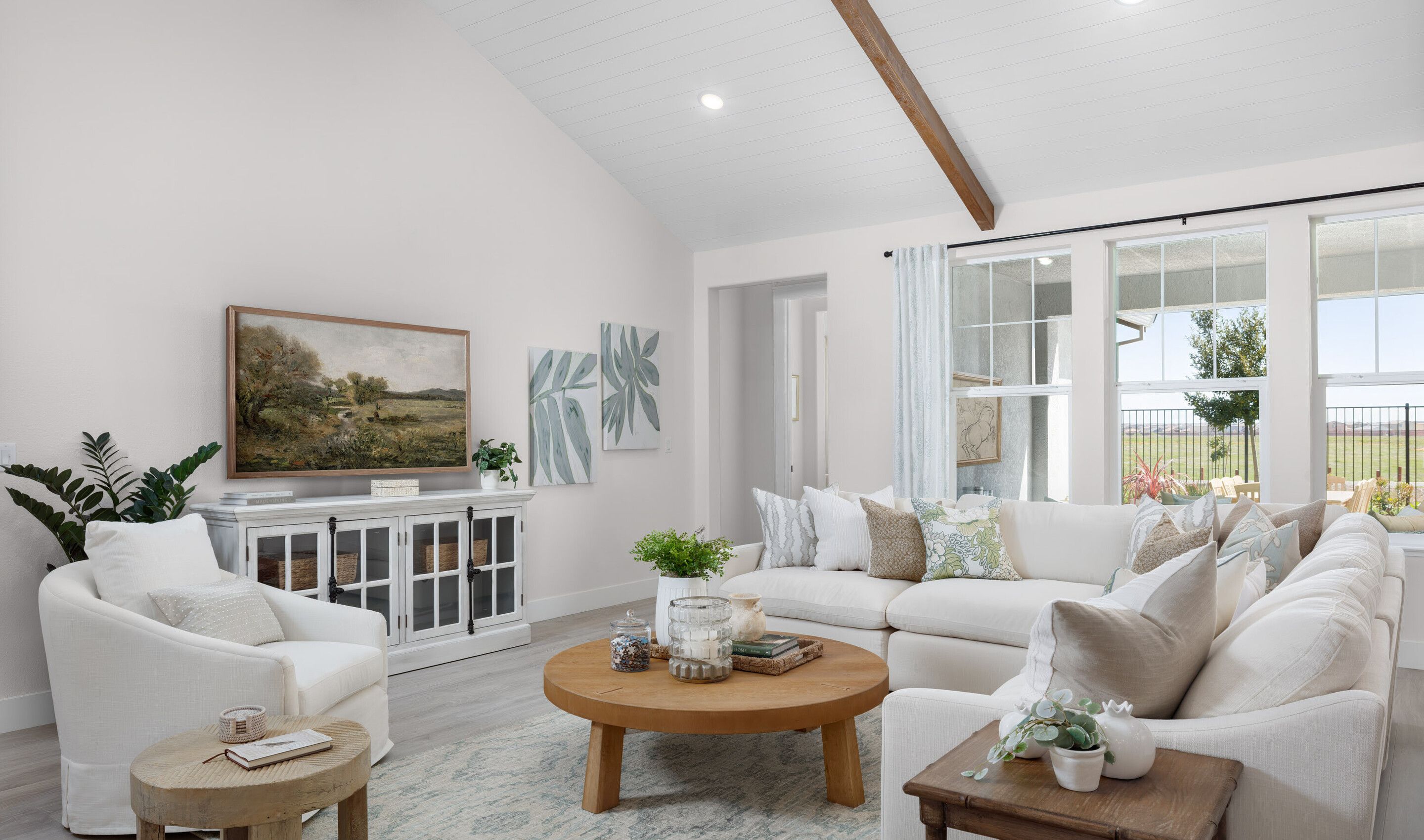 Great room with vaulted ceiling and shiplap detailing