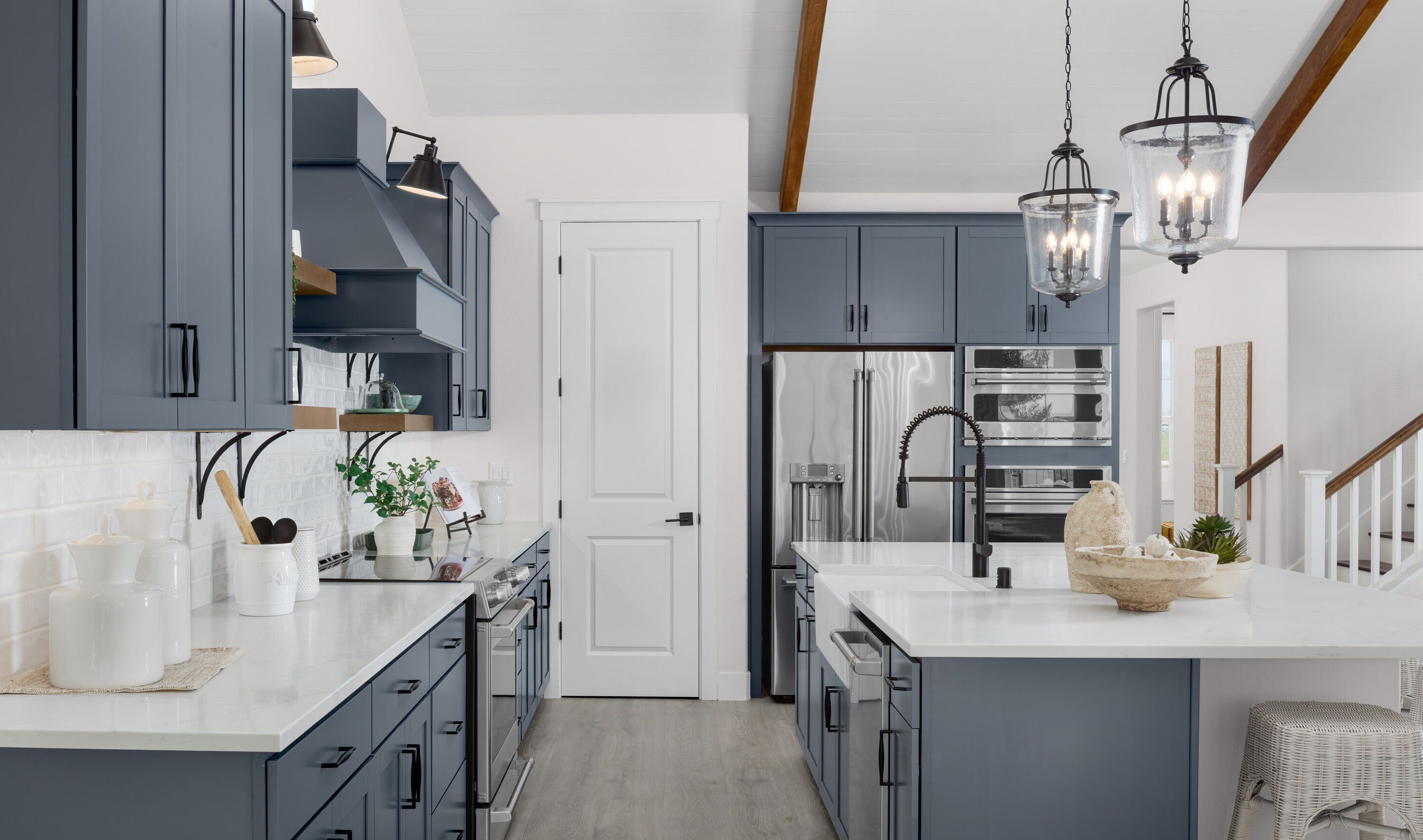 Kitchen with stainless steel appliances and apron-front sink